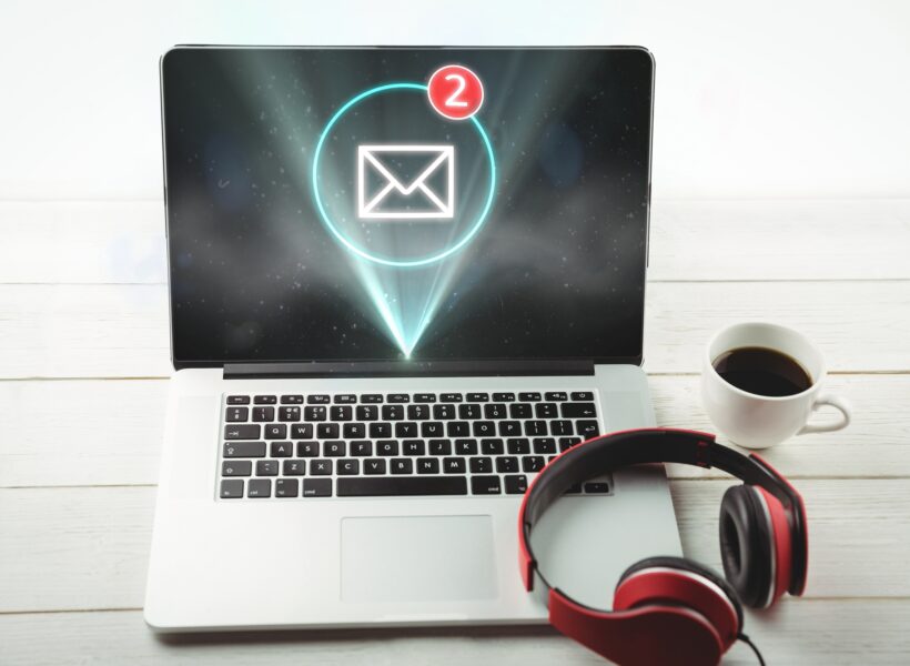 Digital composite of New mail on laptop screen